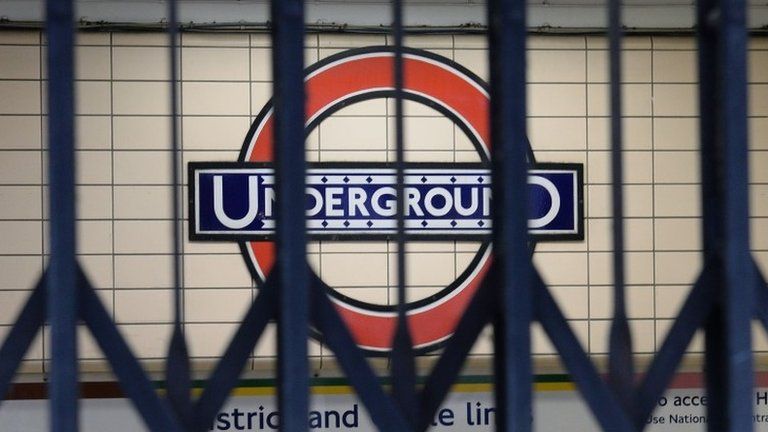 File photo dated 5/8/2015 of a London Underground sign seen through the gates to an entrance at Paddington Underground station