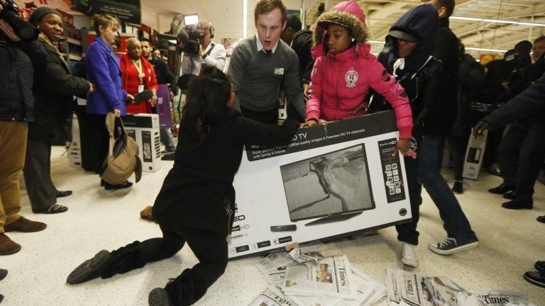 Customers fighting over a TV