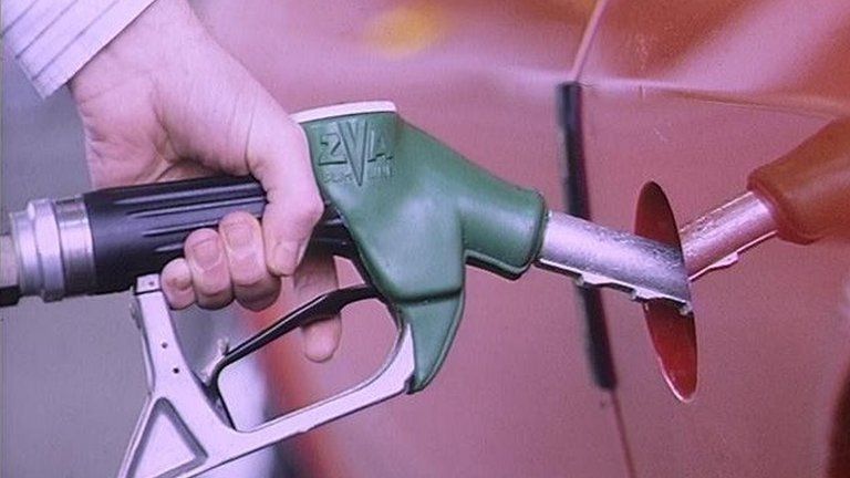 Man filling car with petrol