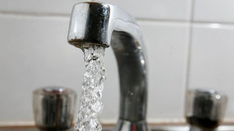 Water coming out of a tap