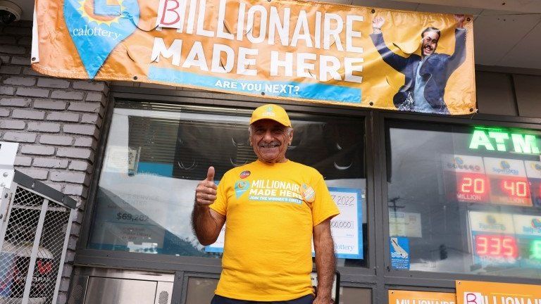 Joseph Chahayed poses after a single winning ticket for the Powerball lottery drawing was sold in at Joe"s Service Center, in Altadena, California, U.S., November 8, 2022.