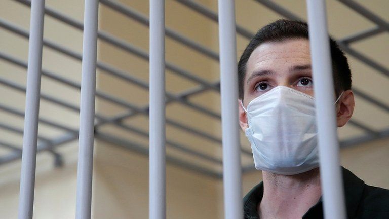 Trevor Reed stands inside a defendants' cage during a court hearing in Moscow, Russia, on 30 July 2020