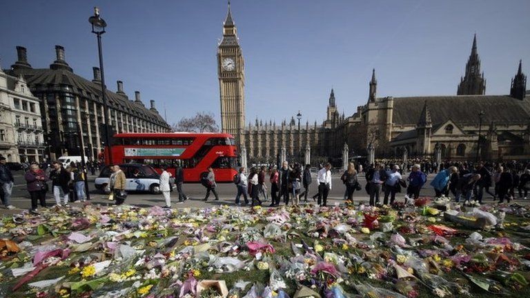 Floral tributes to the victims of the Westminster attack are placed outside the Palace of Westminster, London, Monday March 27, 2017