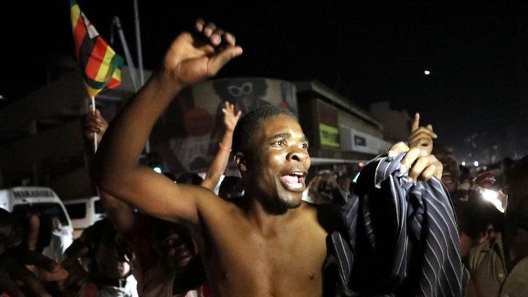 Zimbabweans celebrate after President Robert Mugabe resigns in Harare, Zimbabwe