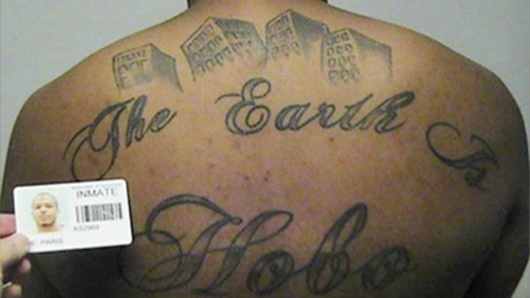 Alleged Hobos hitman, Paris Poe's back with tattoos reading The Earth is Our Turf and Hobo, 12 September 2017