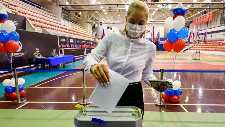 A woman votes in Vladivostok on Russia's constitutional reforms