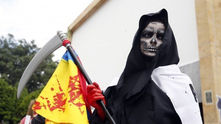A women wearing a reaper costume participates in a new day of protests in Medellin, Colombia, 28 May 2021