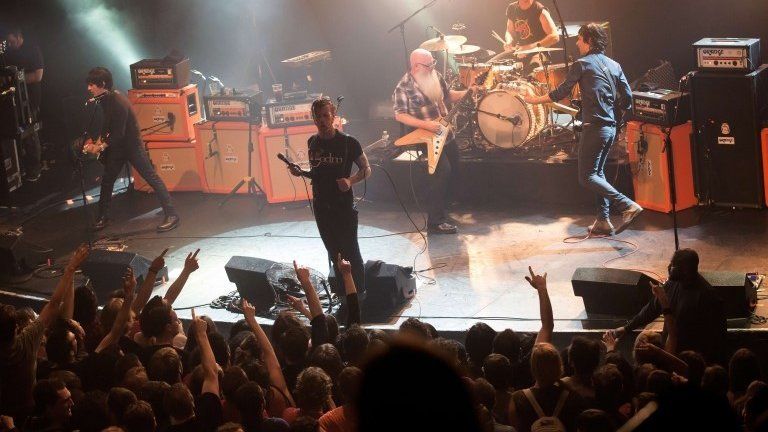 Eagles of Death Metal perform on stage on 13 November 2015 at the Bataclan concert hall in Paris