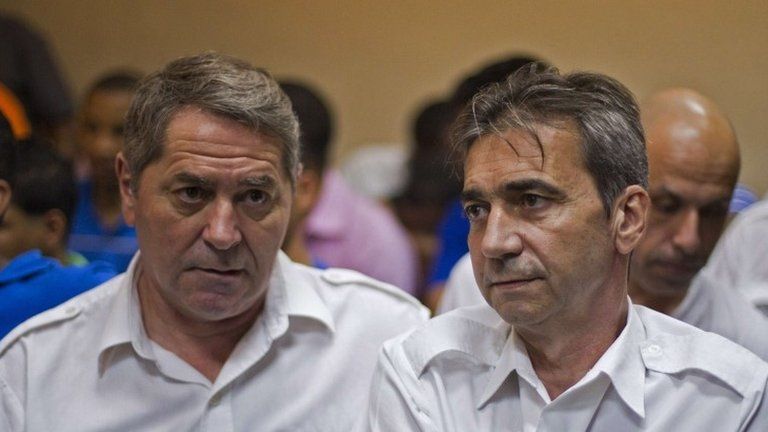 French pilots Jean Pascal Fauret (left) and co-pilot Armand Victor Bruno Odos attending a court hearing in the Dominican Republic on 4 February 2014