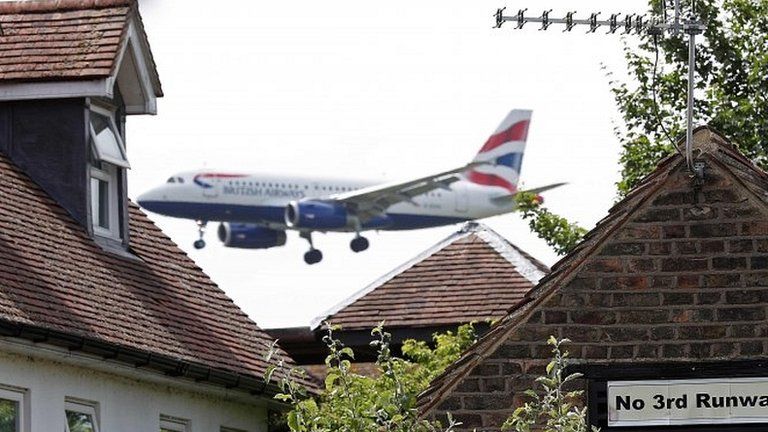 A British Airways plane approaches Heathrow