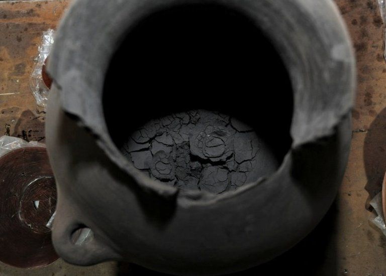 A pot with human ashes, part of an altar unearthed by archaeologists at a plot near Plaza Garibaldi in downtown Mexico City, is seen in this photo distributed to Reuters by the National Institute of Anthropology and History on November 30, 2021