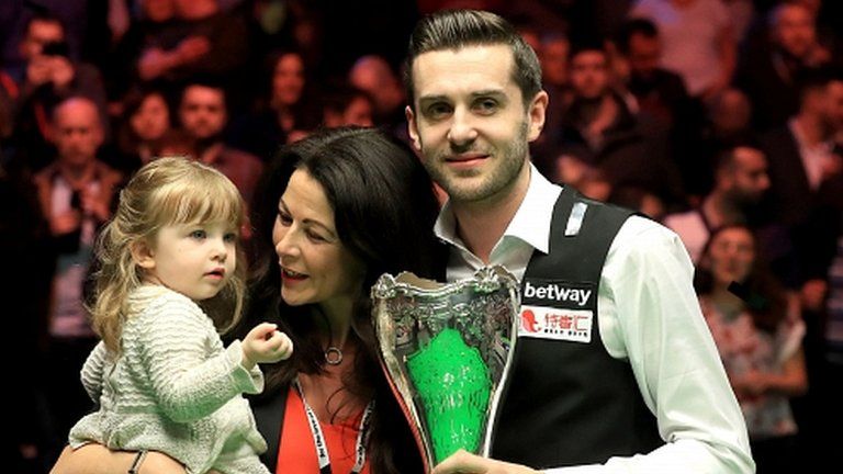 Mark Selby celebrates winning the UK Championship with his family