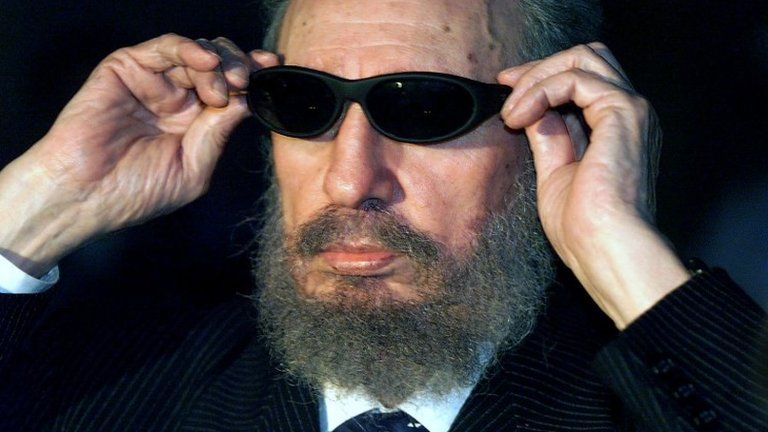 This file photo taken on November 16, 1999 shows Cuban President Fidel Castro trying on a pair of sunglasses as he talks to the media in Havana during the IX Iberoamerican Summit.