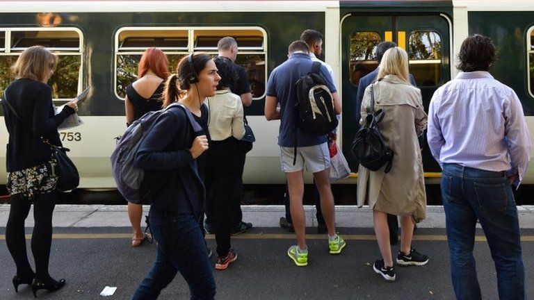 Passengers at a south London station