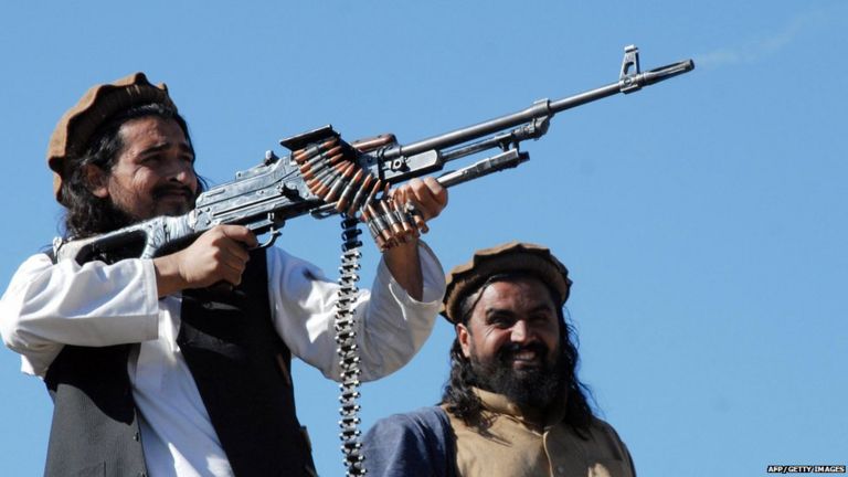 Pakistani Taliban commander Hakimullah Mehsud poses and fires bullets for a group of media representatives in the Mamouzai area of Orakzai Agency.