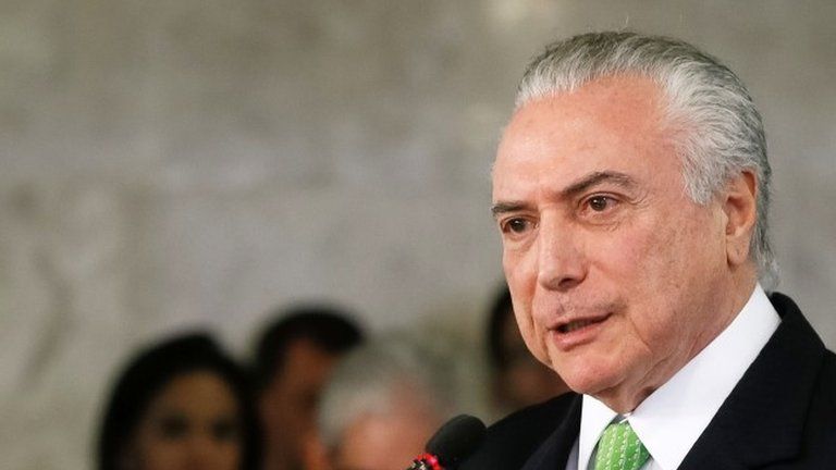 Handout picture released by the Brazilian Presidency showing Brazil"s President Michel Temer speaking during a ceremony in commemoration of the World Environment Day, at the Planalto Palace in Brasilia, Brazil, on June 5, 2017