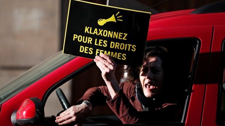 Demonstrator from Amnesty International holds placard outside the Saudi Arabian Embassy to protest on International Women's day to urge Saudi authorities to release jailed women"s rights activists Loujain al-Hathloul, Eman al-Nafjan and Aziza al-Yousef in Paris, France, on 8 March 2019.