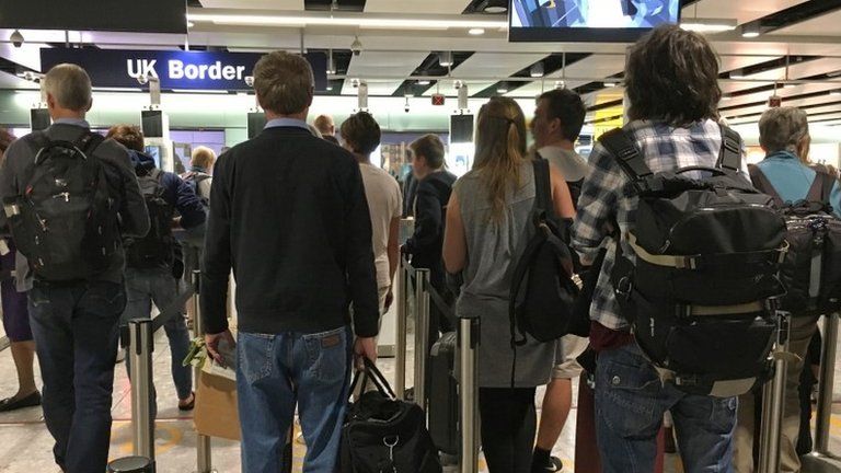 Passengers queuing at Heathrow