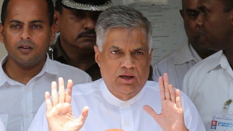 Sri Lankan Prime Minister Ranil Wickremesinghe of the United National Party gestures after casting his vote in the General election on August 17, 2015 in Colombo, Sri Lanka