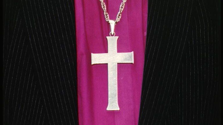 A cross worn on a chain