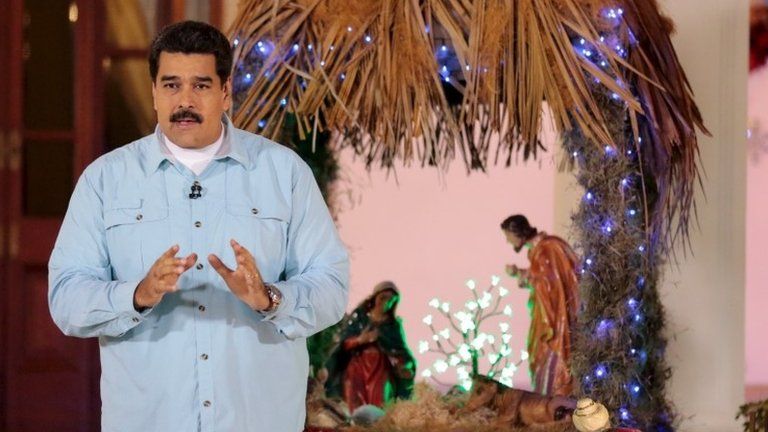 President Nicolas Maduro speaks in front of a nativity scene during his weekly broadcast ) at Miraflores Palace in Caracas, in this December 29, 2015 handout picture provided by Miraflores Palace.