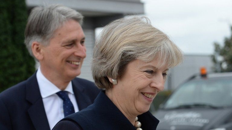 Prime Minister Theresa May and Chancellor of the Exchequer Philip Hammond at Heathrow