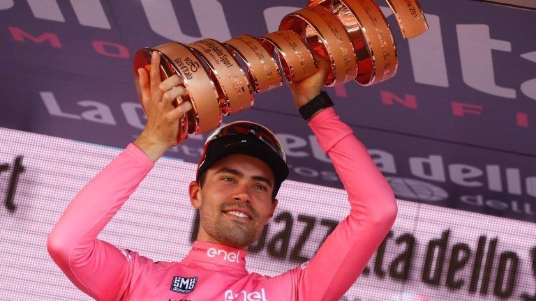 Tom Dumoulin celebrates with Giro d'Italia trophy