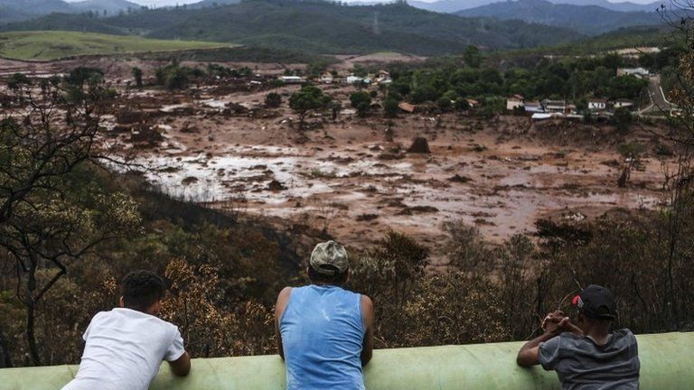 Residents observe the destruction caused by the burst dams in Minas Gerais, Brazil - 6 Nov 2015