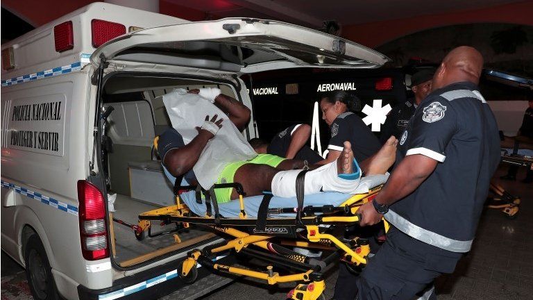 An injured inmate is carried on a stretcher into a hospital by police paramedics after a shootout among inmates at La Joyita prison, in Panama City, Panama December 17, 2019