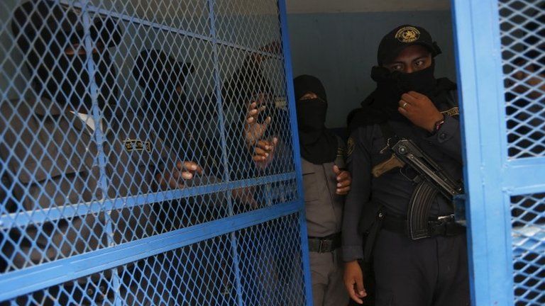 Guards are seen at the entry of a prison in Guatemala City on 10 September, 2015