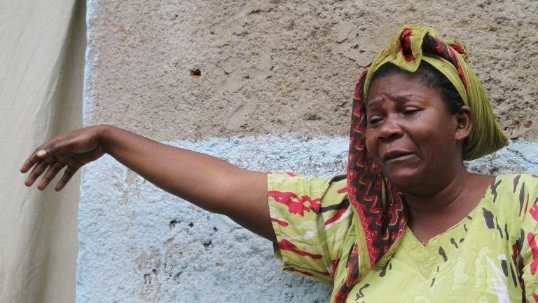 A woman mourns after the death of her son in gunfire in Burundi, 12 December 2015