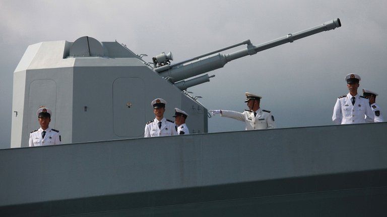 Chinese navy servicemen onboard the Chinese missile frigate Yuncheng (571) in Hong Kong on 30 April 30 2012