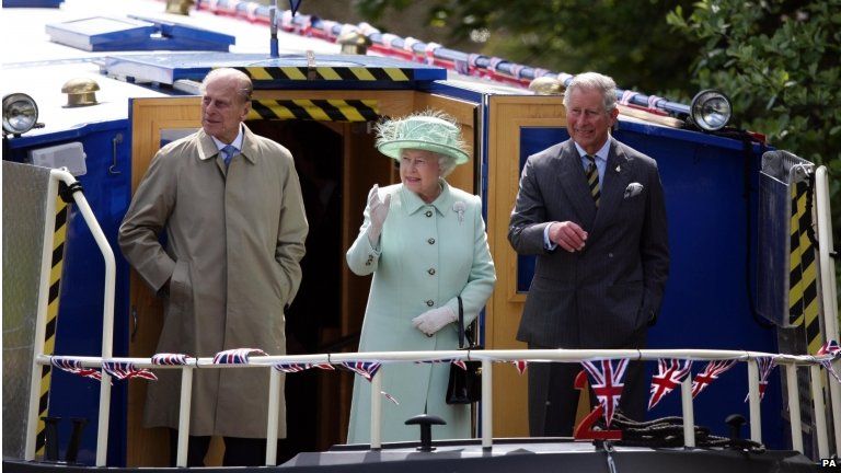 The Queen, Duke of Edinburgh and Prince Charles on a barge in Burnley