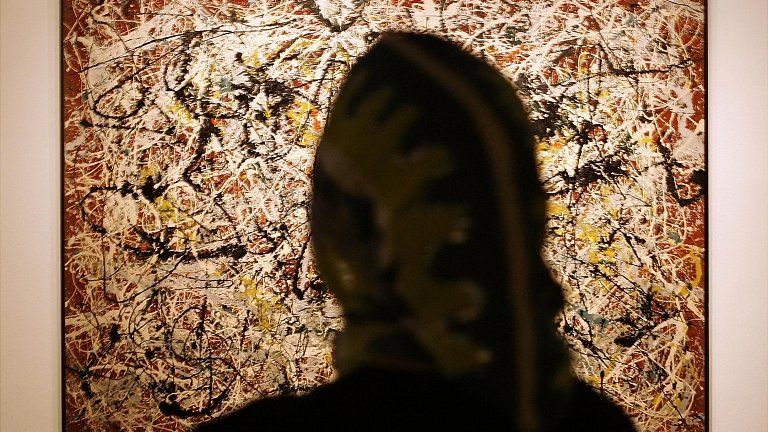 Woman views Jackson Pollock's Mural on Indian Red Ground