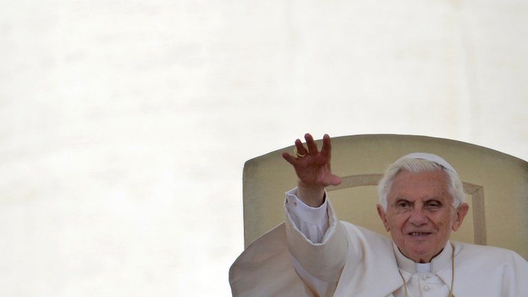 Pope Benedict XVI waves during his weekly general audience