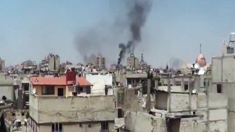 Smoke rising above Homs, date and location cannot be verified