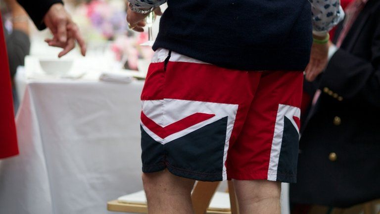 Man wearing union flag shorts