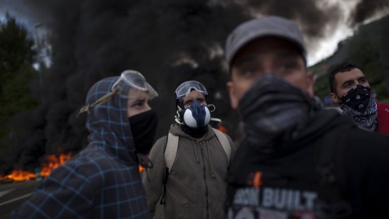 Masked miners protesting in Leon, northern Spain, 12 June