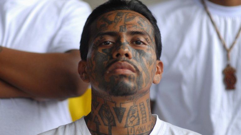 Gang member attends Mass in the prison of Izalco, about 65 km (40 miles) from San Salvador 19 June 2012.