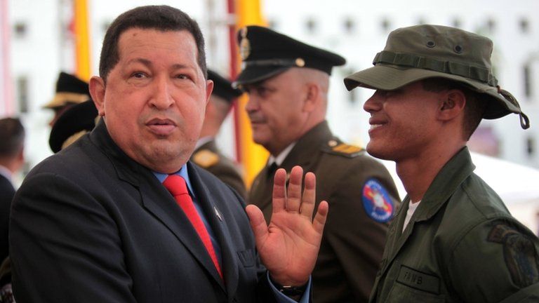 President Hugo Chavez talks to a soldier in Caracas