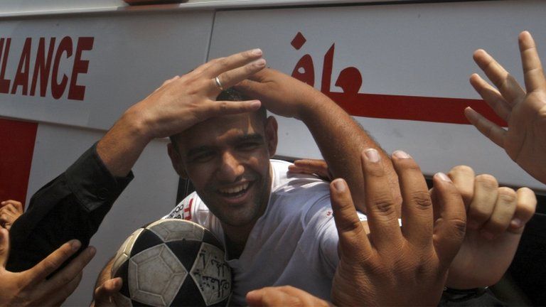 Mahmoud Sarsak, a former player with the Palestinian national football team arrives at al-Shifa hospital in Gaza City