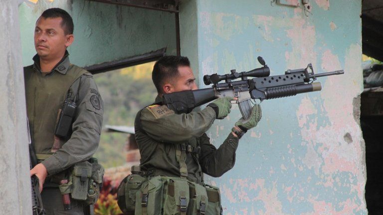 Police guarding the police station in Toribio, Cauca province