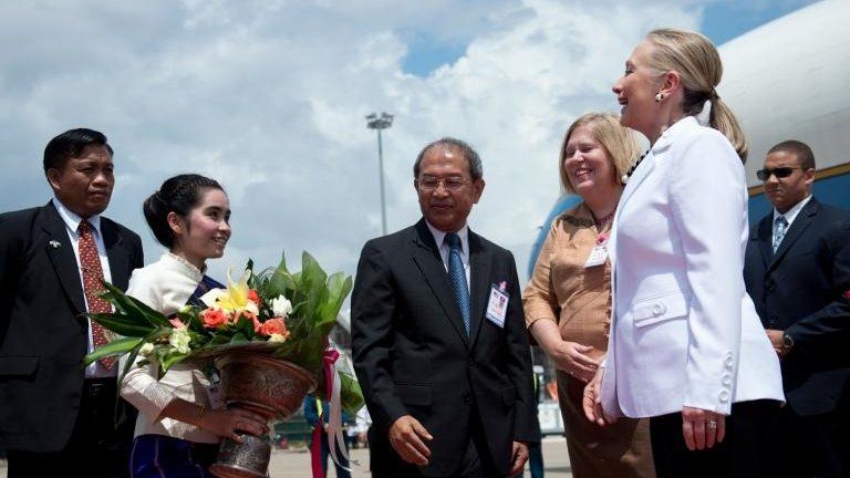 US Secretary of State Hillary Clinton is greeted upon her arrival at Wattay International Airport in Vientiane on 11 July, 2012