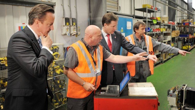 David Cameron and Nick Clegg with engineers at the Soho Depot in Smethwick