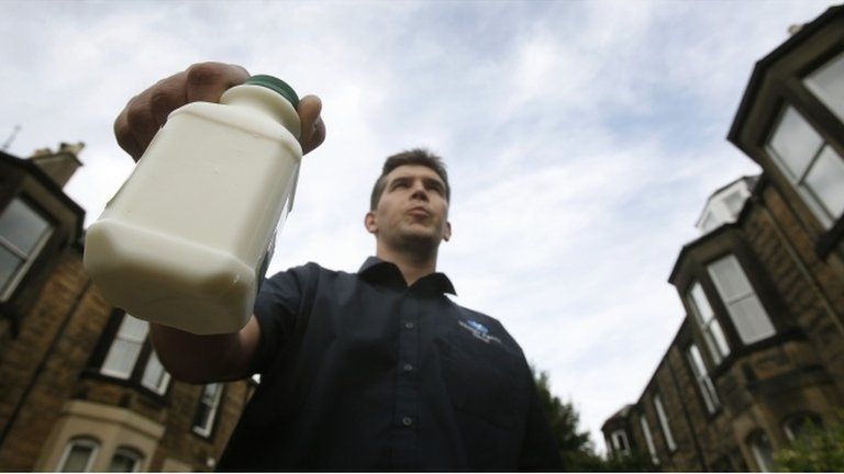 Dairy farmer Simon McCreery delivers free bottles of milk in Edinburgh to highlight cuts in the price he receives for his milk