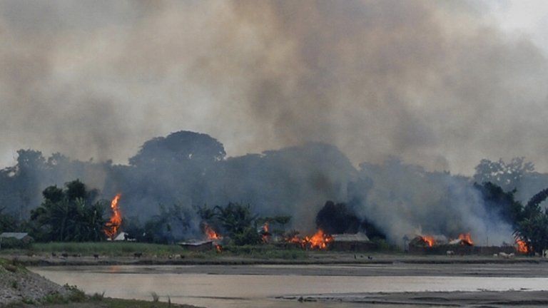 Flames erupt from huts built on the banks of river Gourang during violence near Kokrajhar town in the northeastern Indian state of Assam July 24, 2012