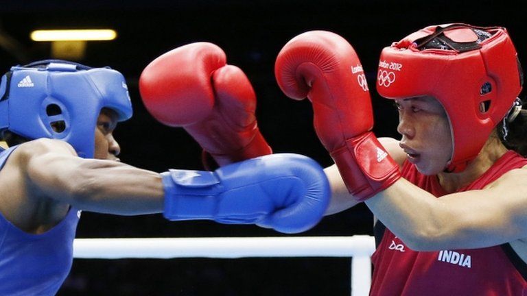 Indian boxer MC Mary Kom (R) fights Great Britain's Nicola Adams at the London 2012 Olympics