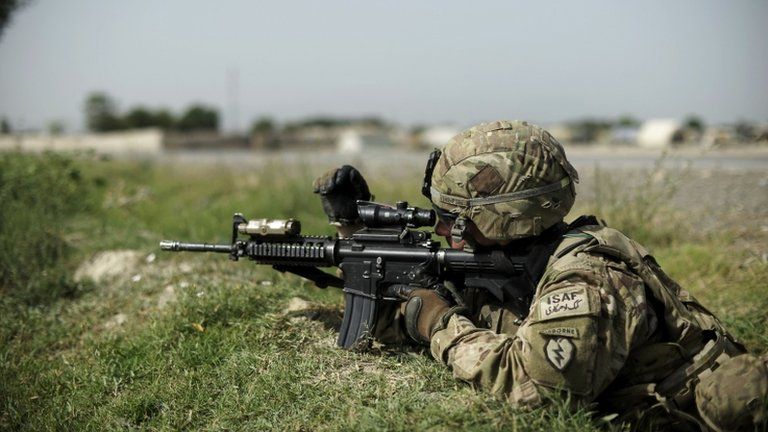 An Isaf soldier takes aim in Afghanistan (file image)
