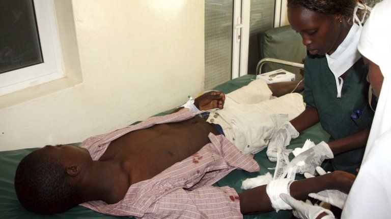 Nurses attend to a victim of the Tana river clashes between the pastoralists and farmers within the Tana river delta, at the Malindi District hospital, 7 September 2012