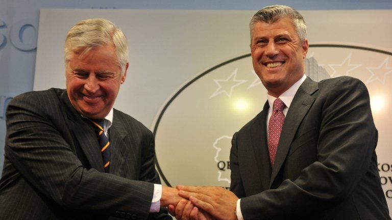 Kosovo Prime Minister Hashim Thaci , right, handshakes with International Civilian Representative, Pieter Feith